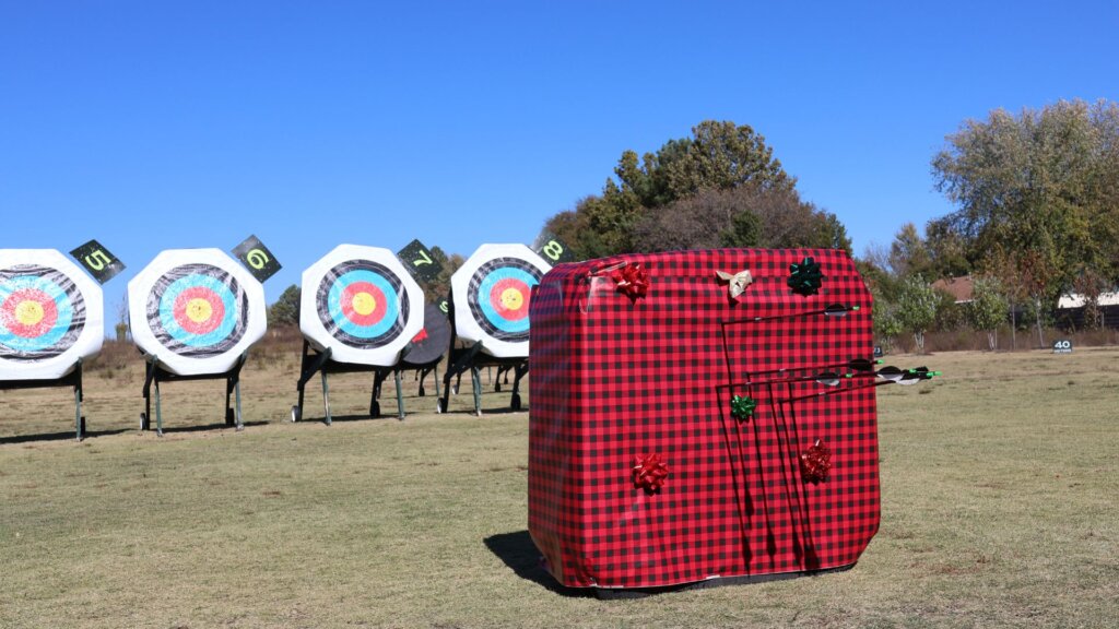 Wrapped christmas present target with christmas bows and targets in the background